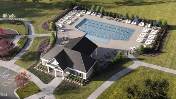 a view of a swimming pool with a bench in patio