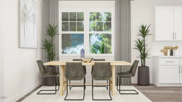 a view of a dining room with furniture and a window