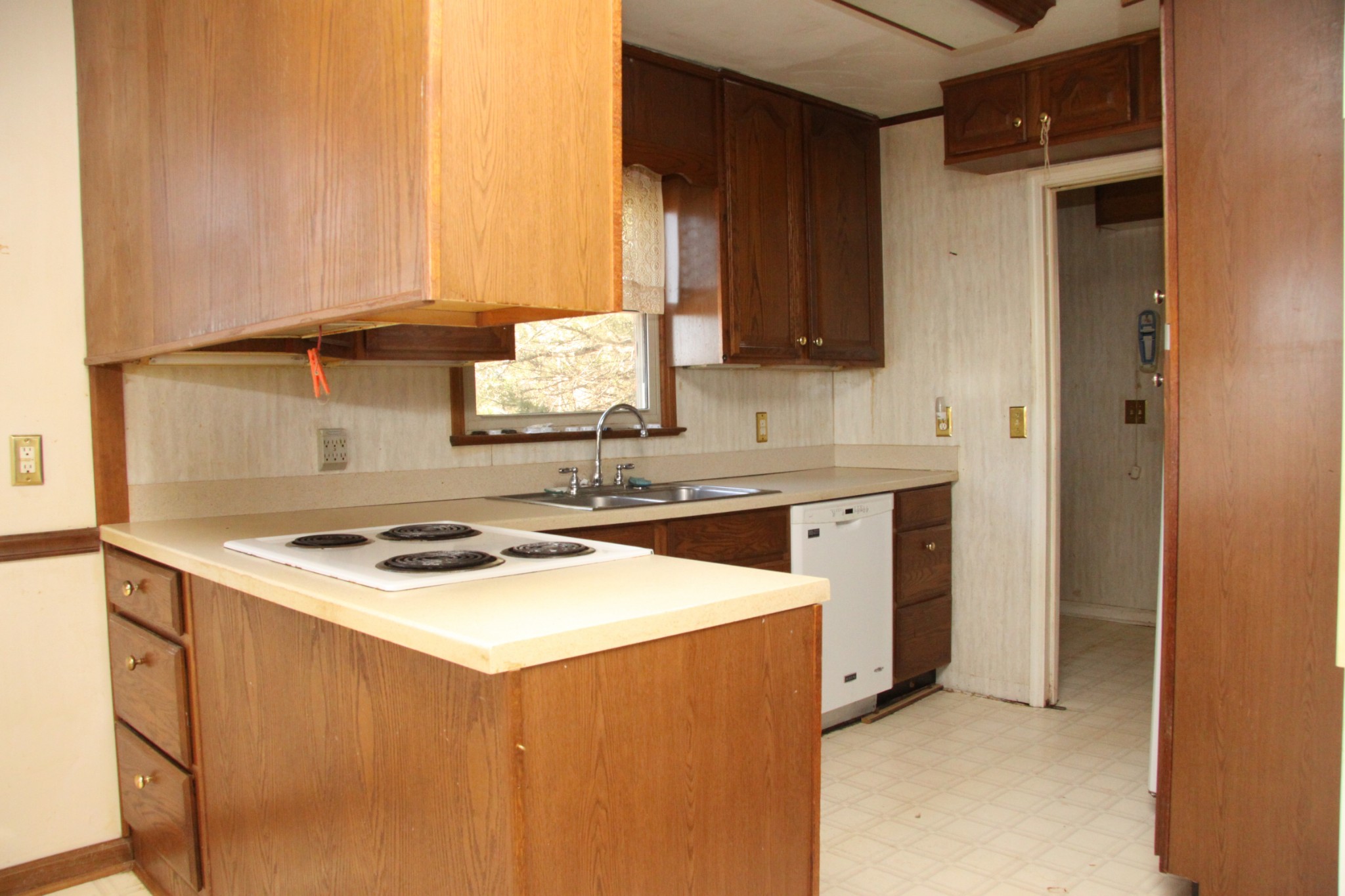 8818 Newtown Road Rockvale, TN 37153 - Photo 4 of 17 a kitchen with a stove a sink and a microwave