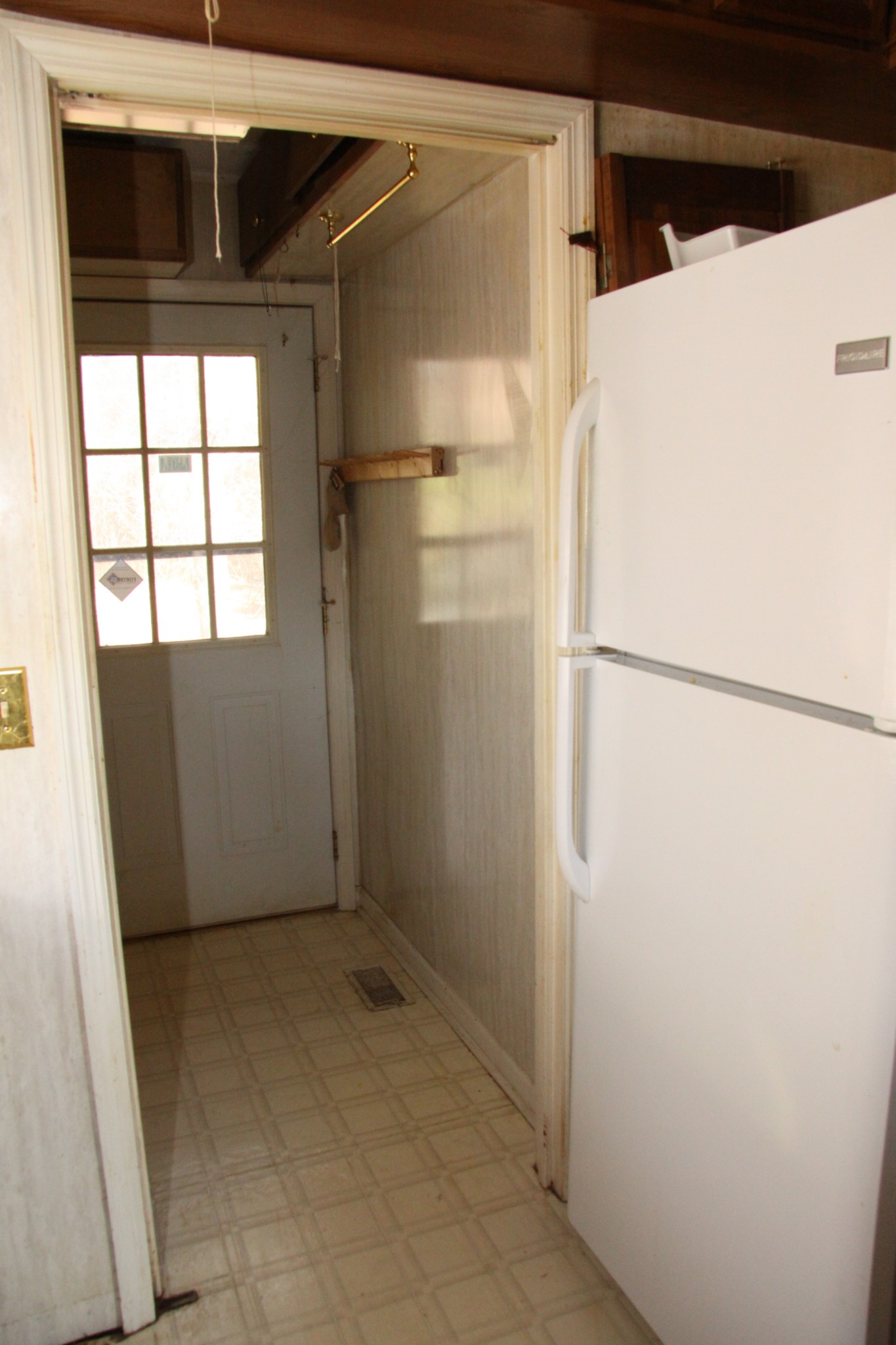 8818 Newtown Road Rockvale, TN 37153 - Photo 6 of 17 a view of storage and utility room with a refrigerator