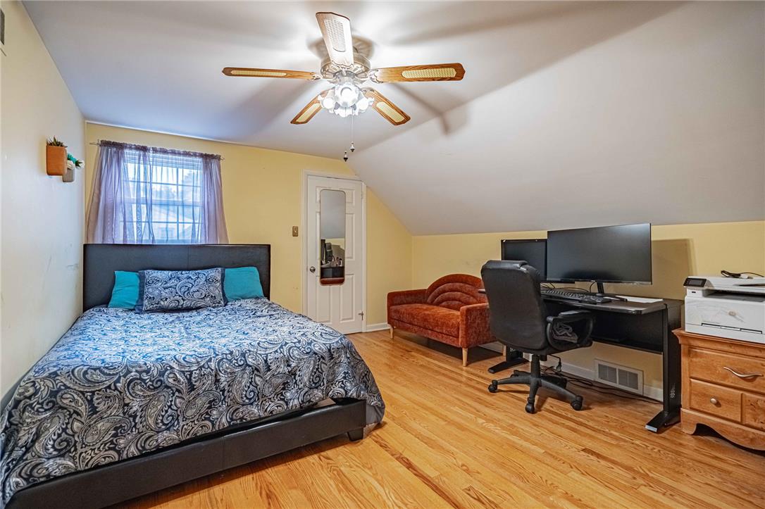 285 Bridle Path Road Bethlehem, PA 18017 - Photo 37 of 54 a bedroom with a bed a chair and a chandelier