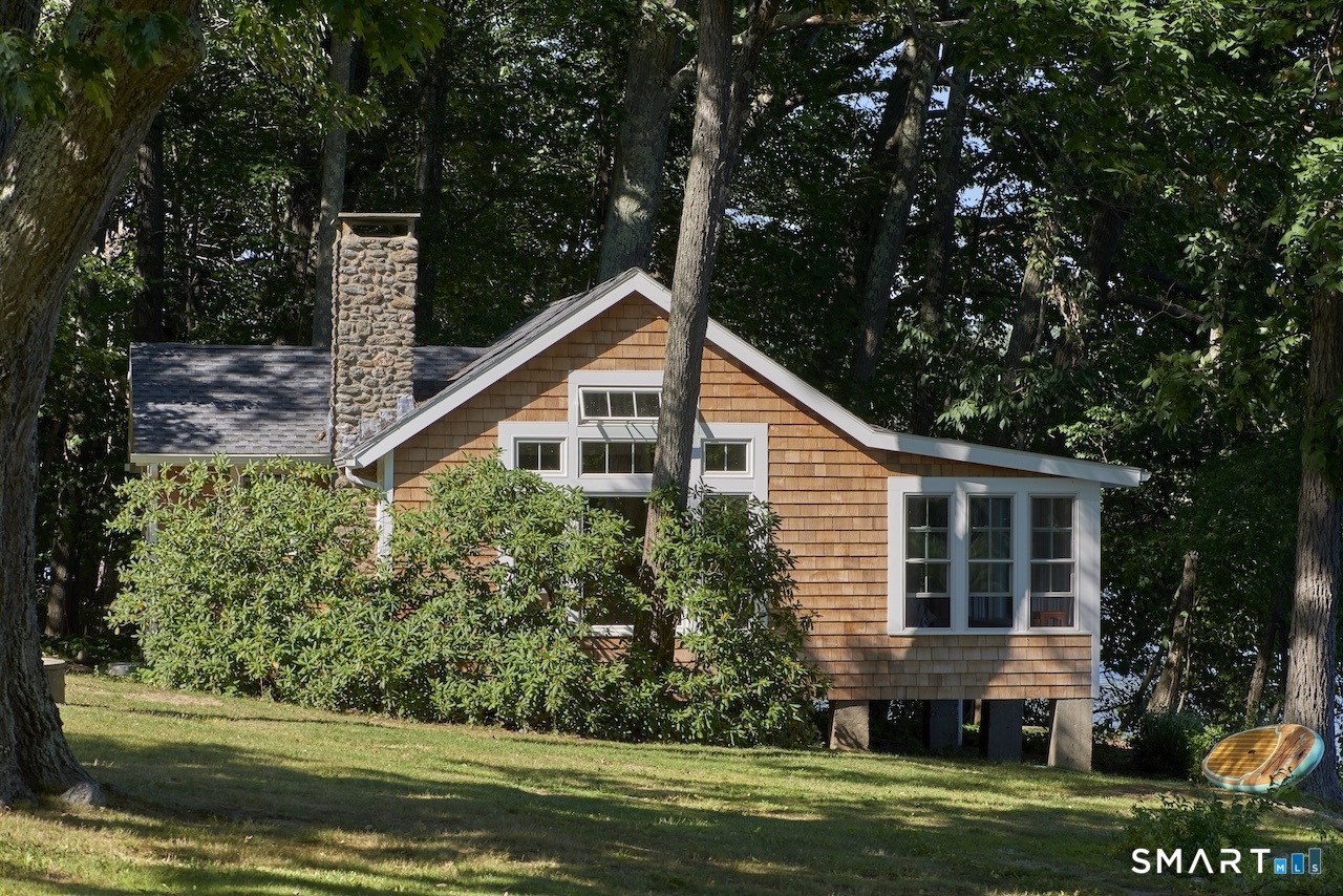 63 Old Cne Road Salisbury, CT 06039 - Photo 31 of 39 a front view of a house with a yard and potted plants