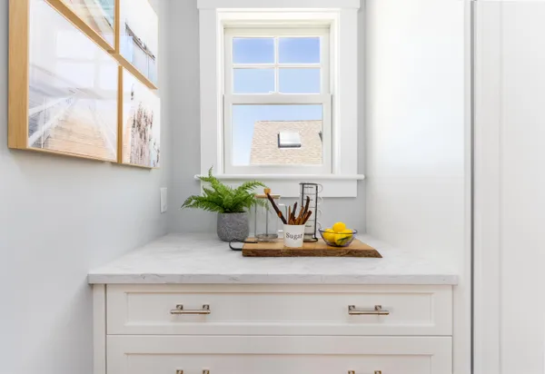 a bathroom with a granite countertop sink a toilet and a mirror
