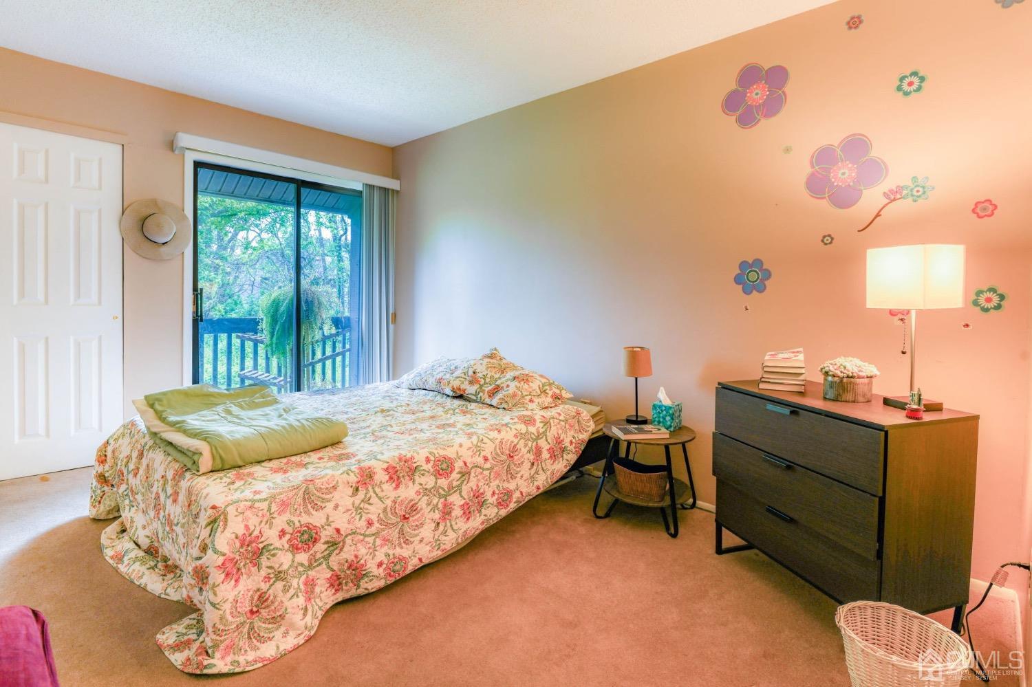 542 Westgate Drive Edison, NJ 08820 - Photo 11 of 30 a bed sitting in a bedroom next to a window