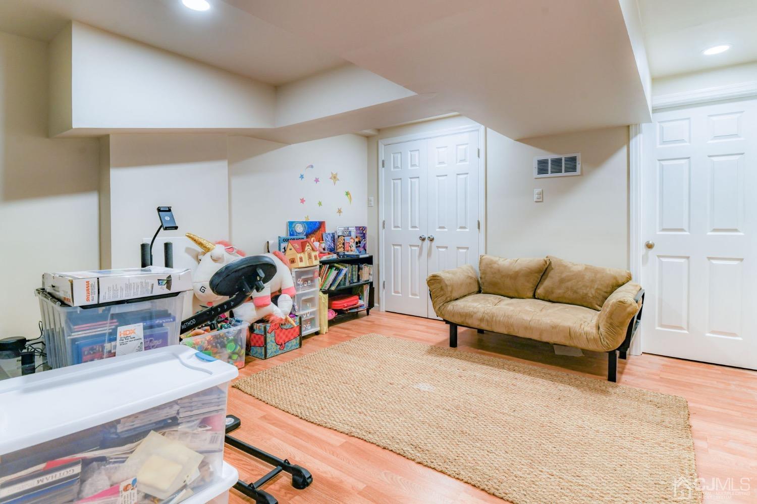 542 Westgate Drive Edison, NJ 08820 - Photo 16 of 30 a living room with furniture and a wooden floor