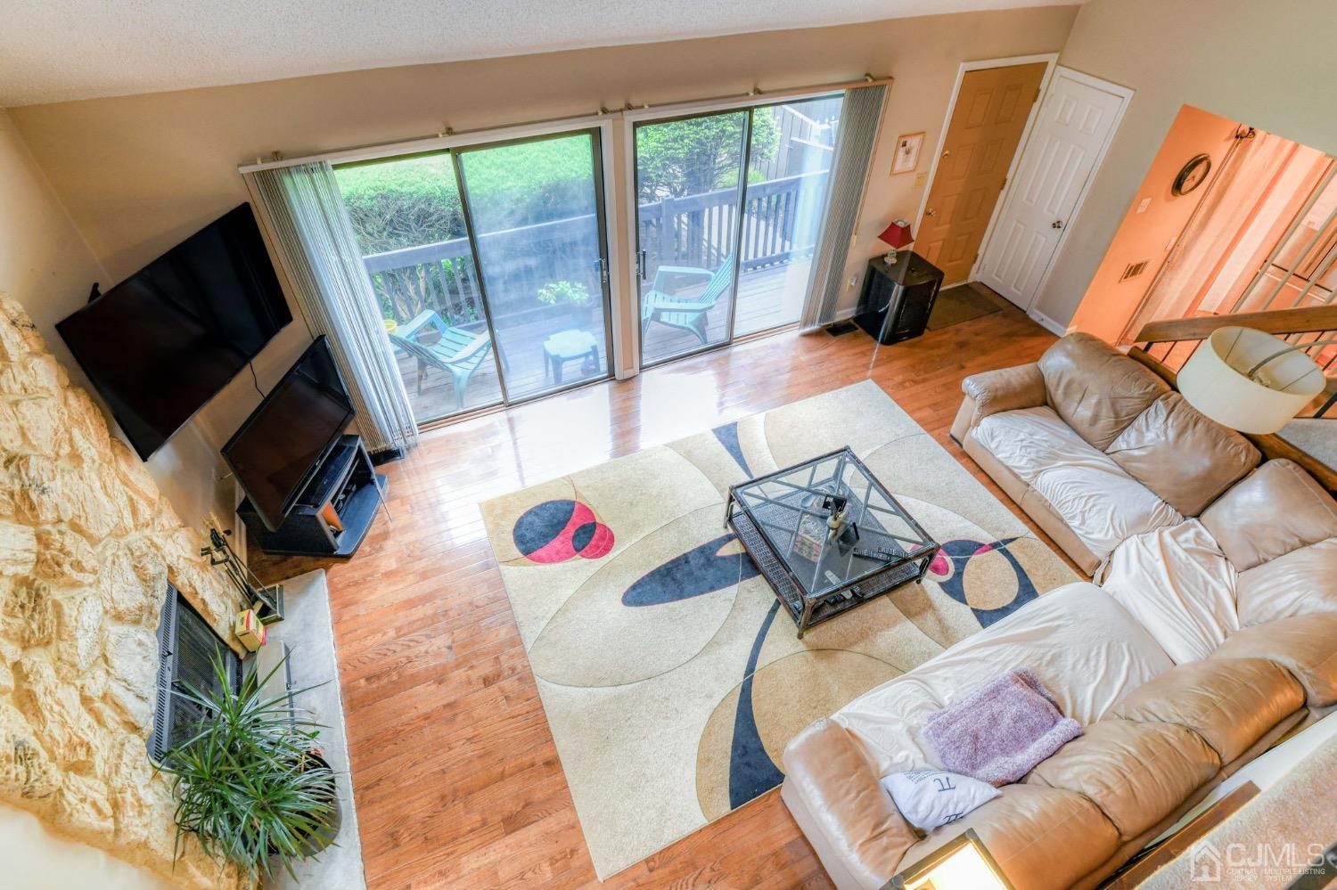 542 Westgate Drive Edison, NJ 08820 - Photo 20 of 30 a view of a living room and a flat screen tv
