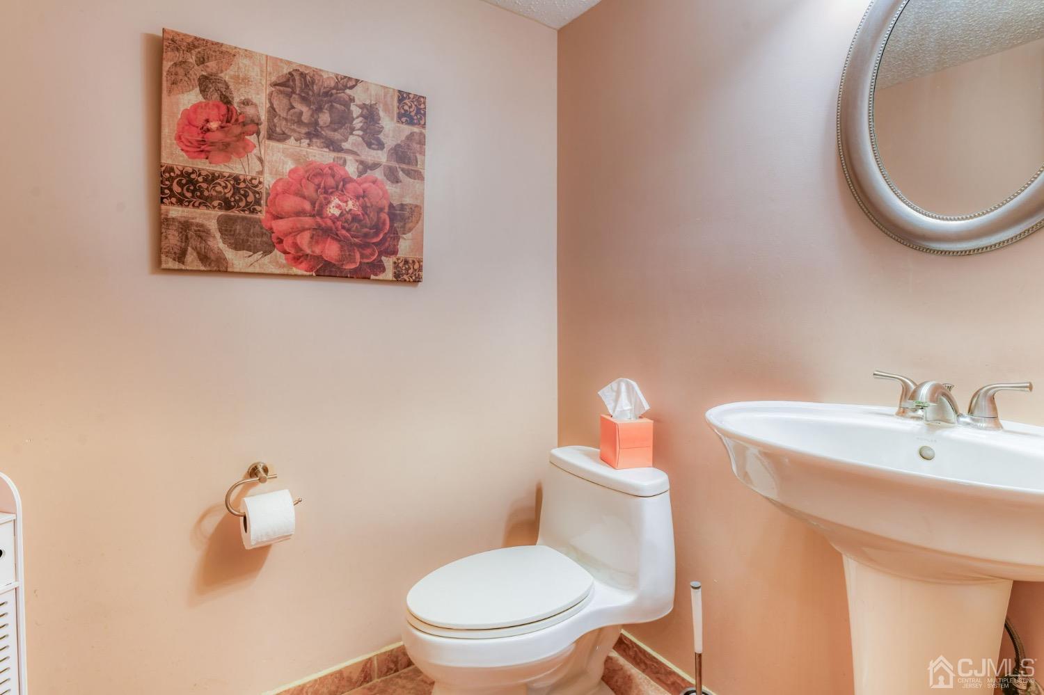 542 Westgate Drive Edison, NJ 08820 - Photo 22 of 30 a white toilet sitting next to a bathroom sink