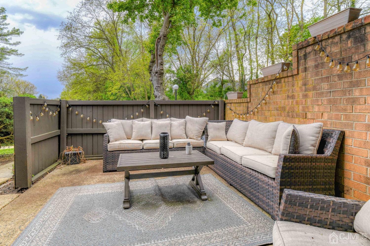 542 Westgate Drive Edison, NJ 08820 - Photo 23 of 30 a roof deck with couches and potted plants