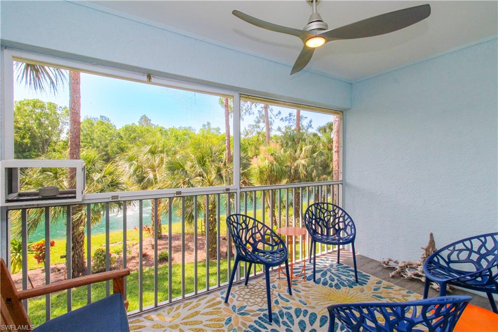 225 Robin Hood Circle, Unit 203 Naples, FL 34104 - Photo 7 of 50 Sunroom / solarium featuring ceiling fan