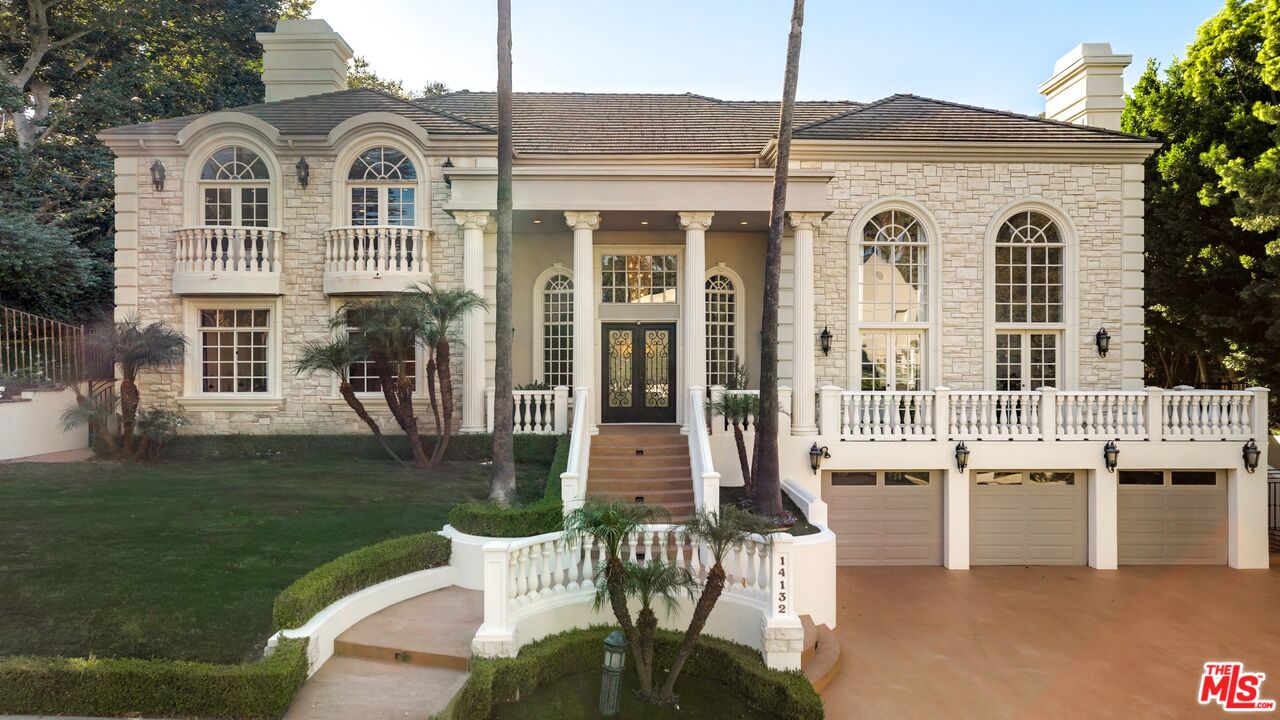 14132 Beresford Road Beverly Hills, CA 90210 - Photo 2 of 21 a view of a white house with a yard