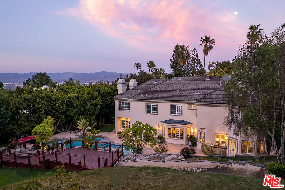 14132 Beresford Road Beverly Hills, CA 90210 - Photo 5 of 21 a view of a house with a garden and a yard