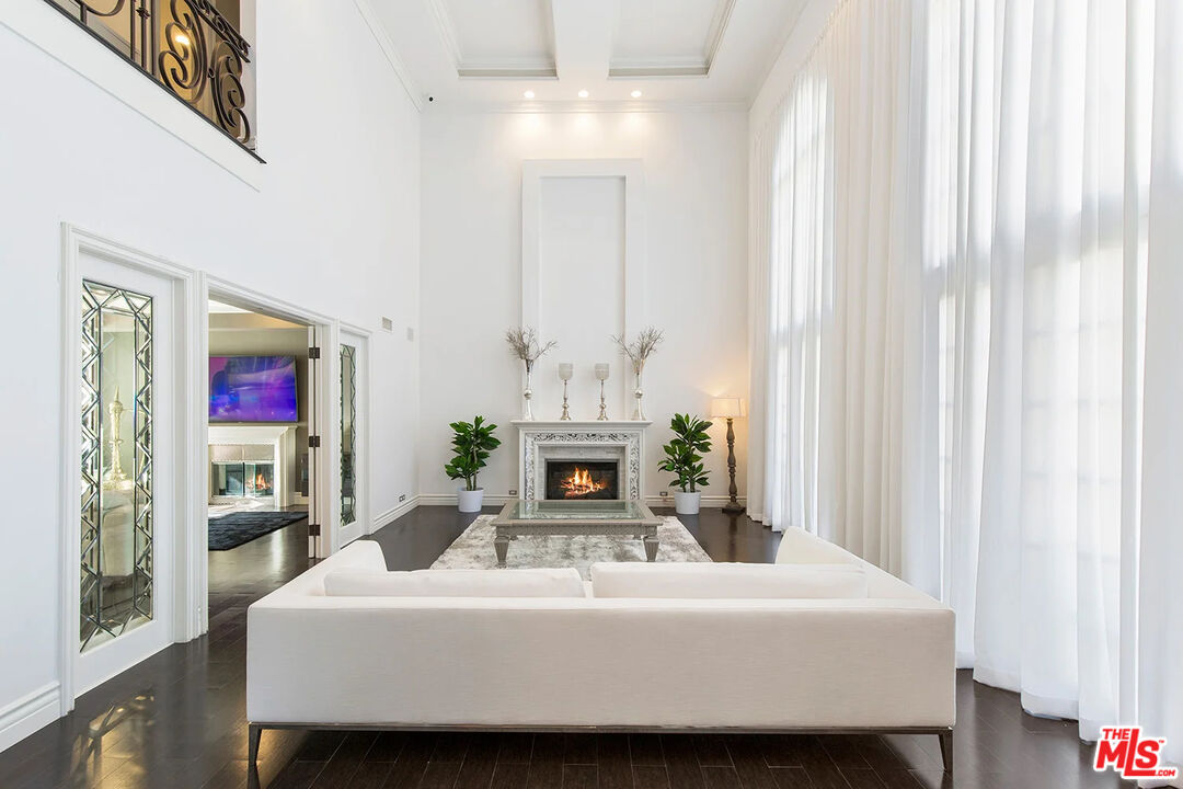 14132 Beresford Road Beverly Hills, CA 90210 - Photo 10 of 21 a living room with furniture and a fireplace