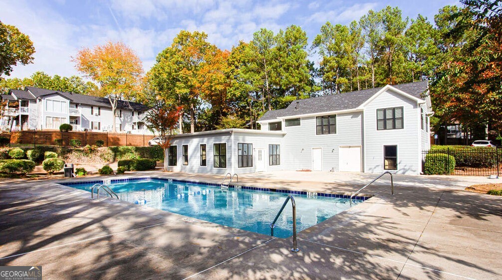 1173 North Hairston Road, Unit 2802 Stone Mountain, GA 30083 - Photo 24 of 31 a front view of a house with a porch