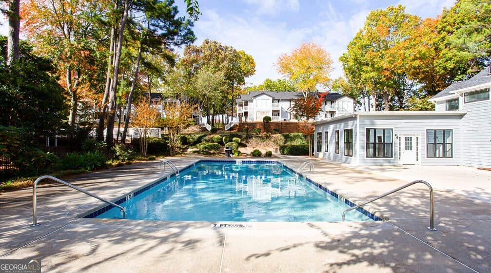 1173 North Hairston Road, Unit 2802 Stone Mountain, GA 30083 - Photo 26 of 31 a view of a white house with swimming pool