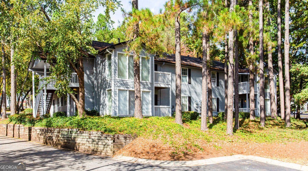1173 North Hairston Road, Unit 2802 Stone Mountain, GA 30083 - Photo 28 of 31 a view of a house with a tree in front