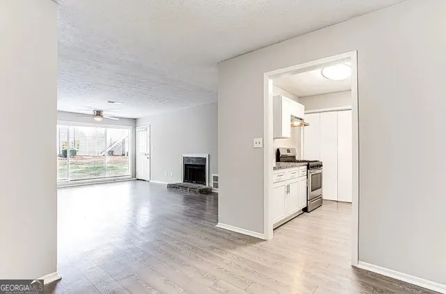 a view of a kitchen with a sink and a stove top oven