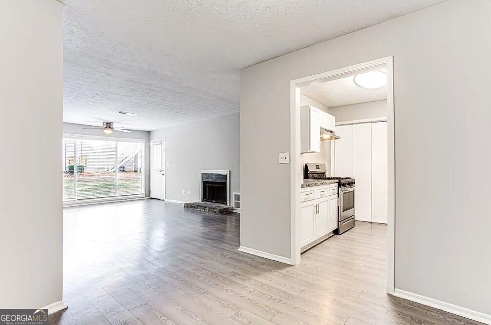 1173 North Hairston Road, Unit 2802 Stone Mountain, GA 30083 - Photo 7 of 31 a view of a kitchen with a sink and a stove top oven