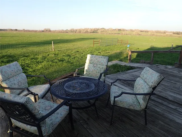 a view of a terrace with furniture and garden