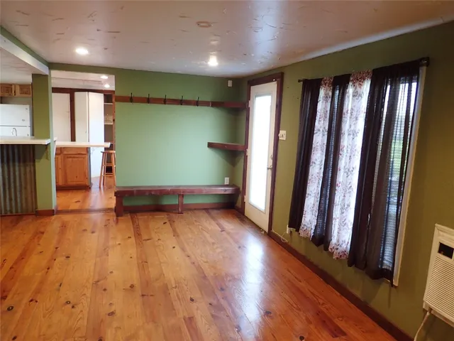 a view of front door with hallway and stairs
