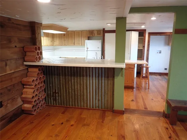 a view of kitchen with furniture and window