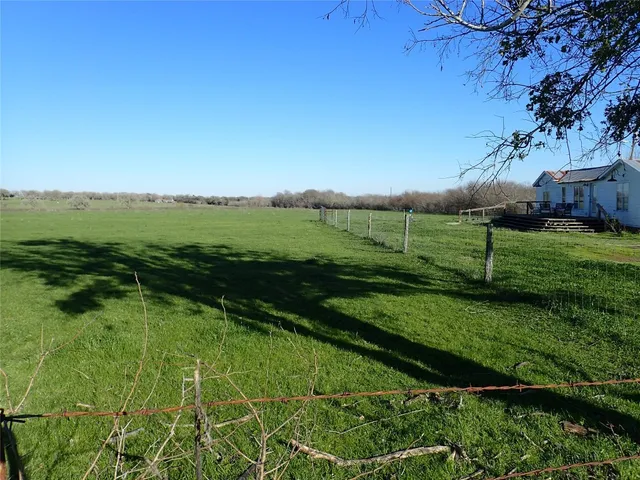 a view of a golf course with a lake