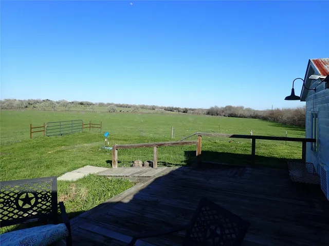 a view of a lake with a yard