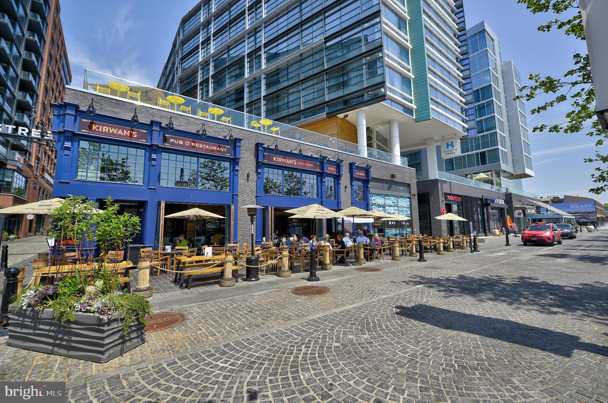 205 G Street Southwest, Unit 145 Washington, DC 20024 - Photo 43 of 46 Vibrant outdoor dining in a bustling locale.