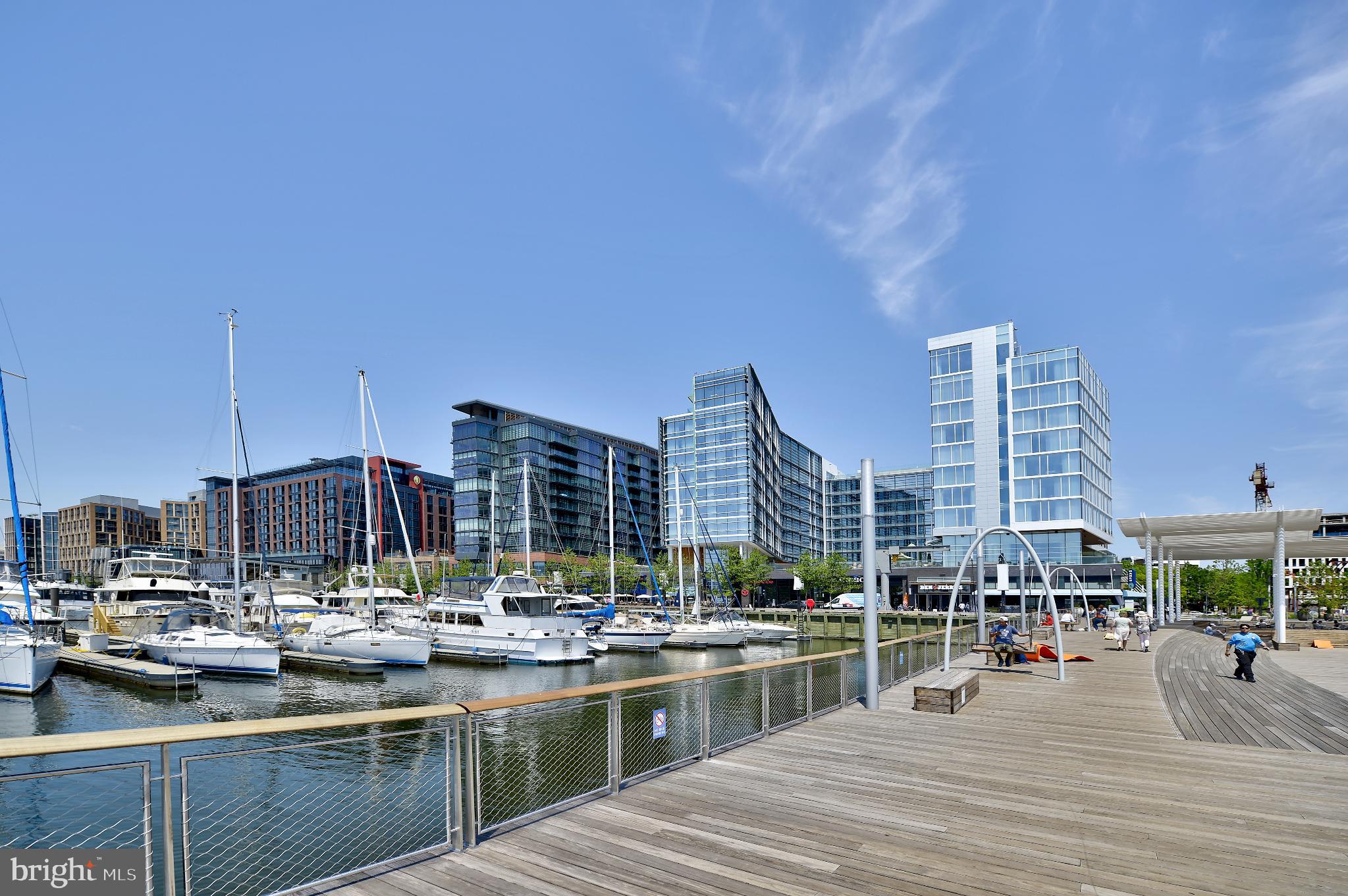 205 G Street Southwest, Unit 145 Washington, DC 20024 - Photo 44 of 46 Modern waterfront with sleek buildings and boats.