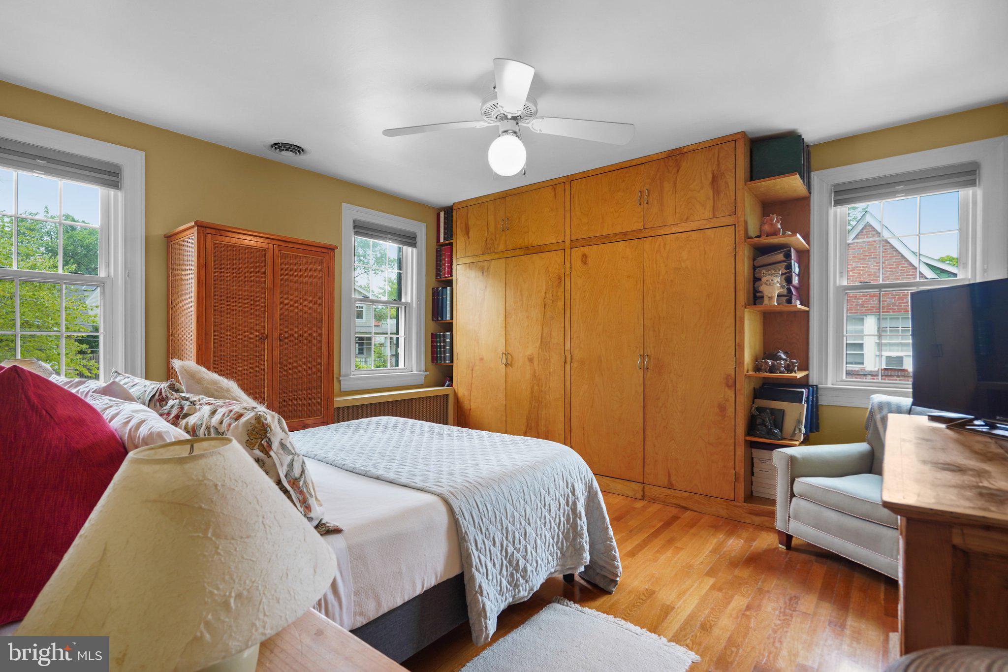 8013 Glenbrook Road Bethesda, MD 20814 - Photo 22 of 41 a bedroom with a bed couch and a dresser next to a window