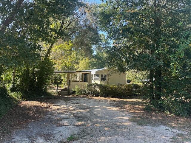 front view of a house with a tree