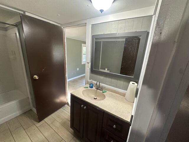 143 West Heather Avenue DeFuniak Springs, FL 32433 - Photo 18 of 20 a bathroom with a sink a mirror and a shower