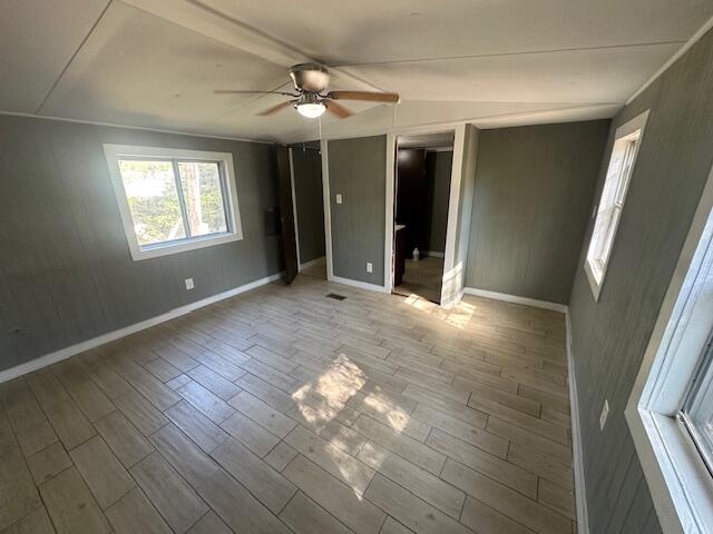 143 West Heather Avenue DeFuniak Springs, FL 32433 - Photo 19 of 20 an empty room with wooden floor and windows