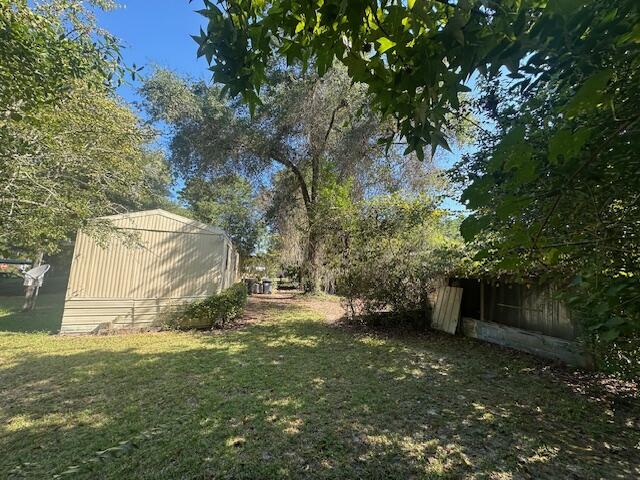 143 West Heather Avenue DeFuniak Springs, FL 32433 - Photo 4 of 20 a view of backyard with green space