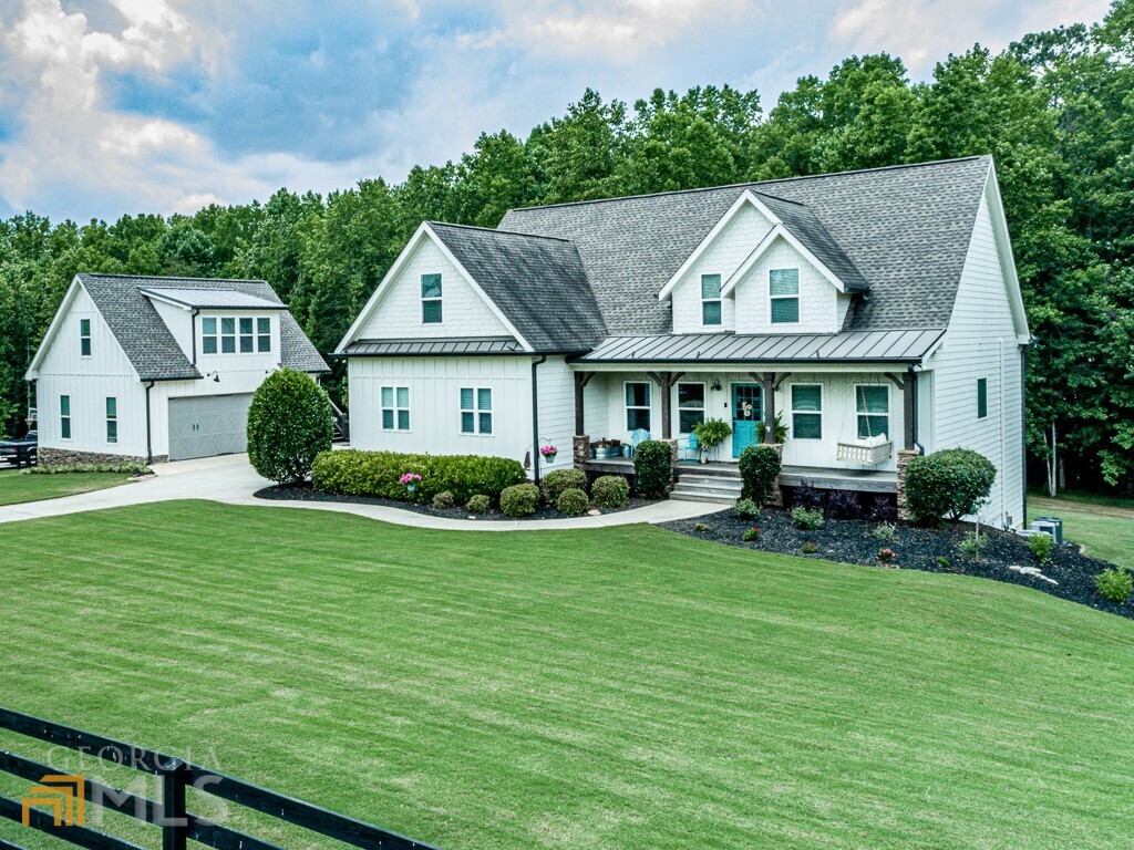 367 Henson Road Canton, GA 30115 - Photo 1 of 1 a front view of a house with garden