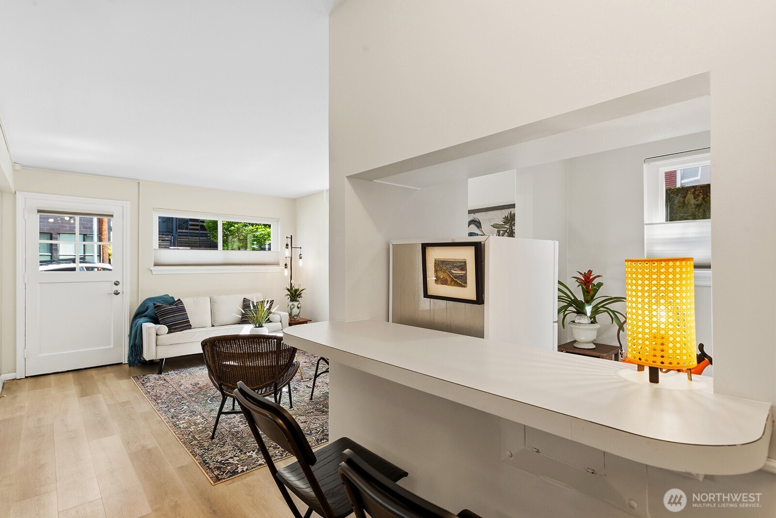 4407 Southwest Alaska Street, Unit 11 Seattle, WA 98116 - Photo 9 of 24 a living room with furniture and a wooden floor