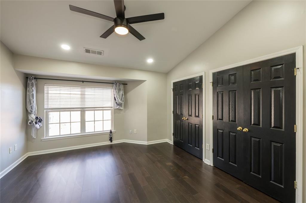 3177 Mill Springs Circle Northeast Buford, GA 30519 - Photo 14 of 27 wooden floor in an empty room with a window