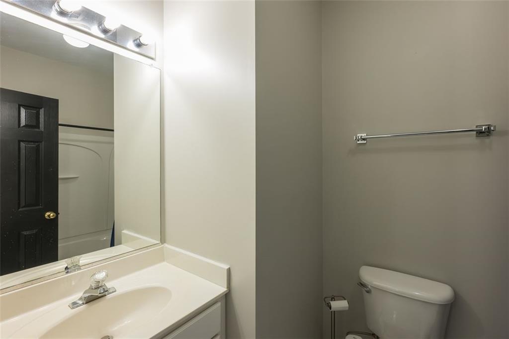 3177 Mill Springs Circle Northeast Buford, GA 30519 - Photo 27 of 27 a bathroom with a sink toilet and shower