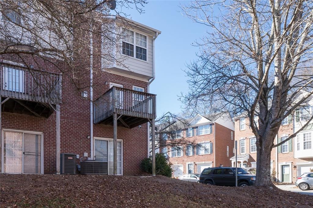 3177 Mill Springs Circle Northeast Buford, GA 30519 - Photo 4 of 27 a view of a building with a street