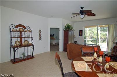 4744 Fairloop Run Lehigh Acres, FL 33973 - Photo 3 of 10 a living room with furniture