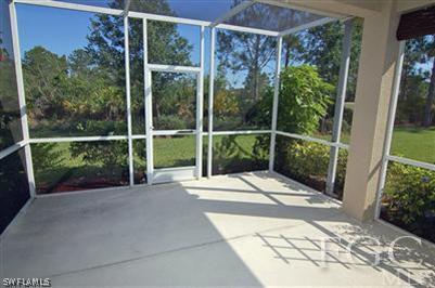 4744 Fairloop Run Lehigh Acres, FL 33973 - Photo 10 of 10 a view of a door and a window