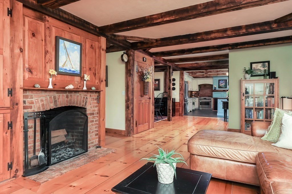 24 Whitney Road Shirley, MA 01464 - Photo 11 of 42 a outdoor living space with a fireplace and a window