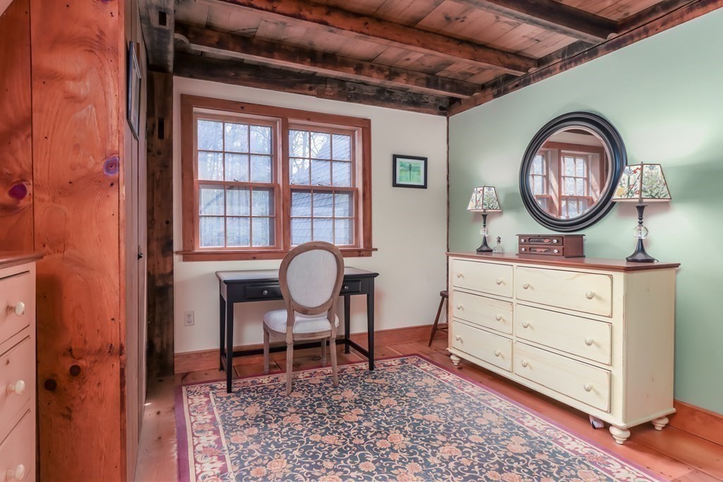 24 Whitney Road Shirley, MA 01464 - Photo 20 of 42 a living room with furniture and a mirror