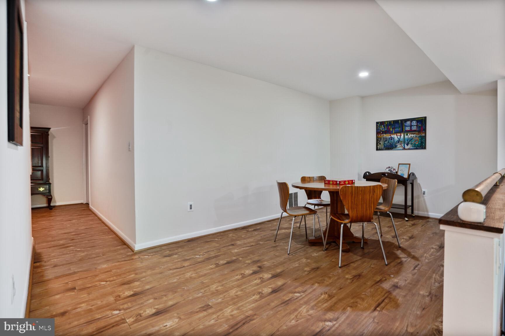 2034 Lakebreeze Way Reston, VA 20191 - Photo 54 of 66 a view of a dining room with furniture and wooden floor
