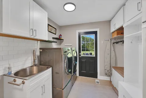 a kitchen with a sink and refrigerator