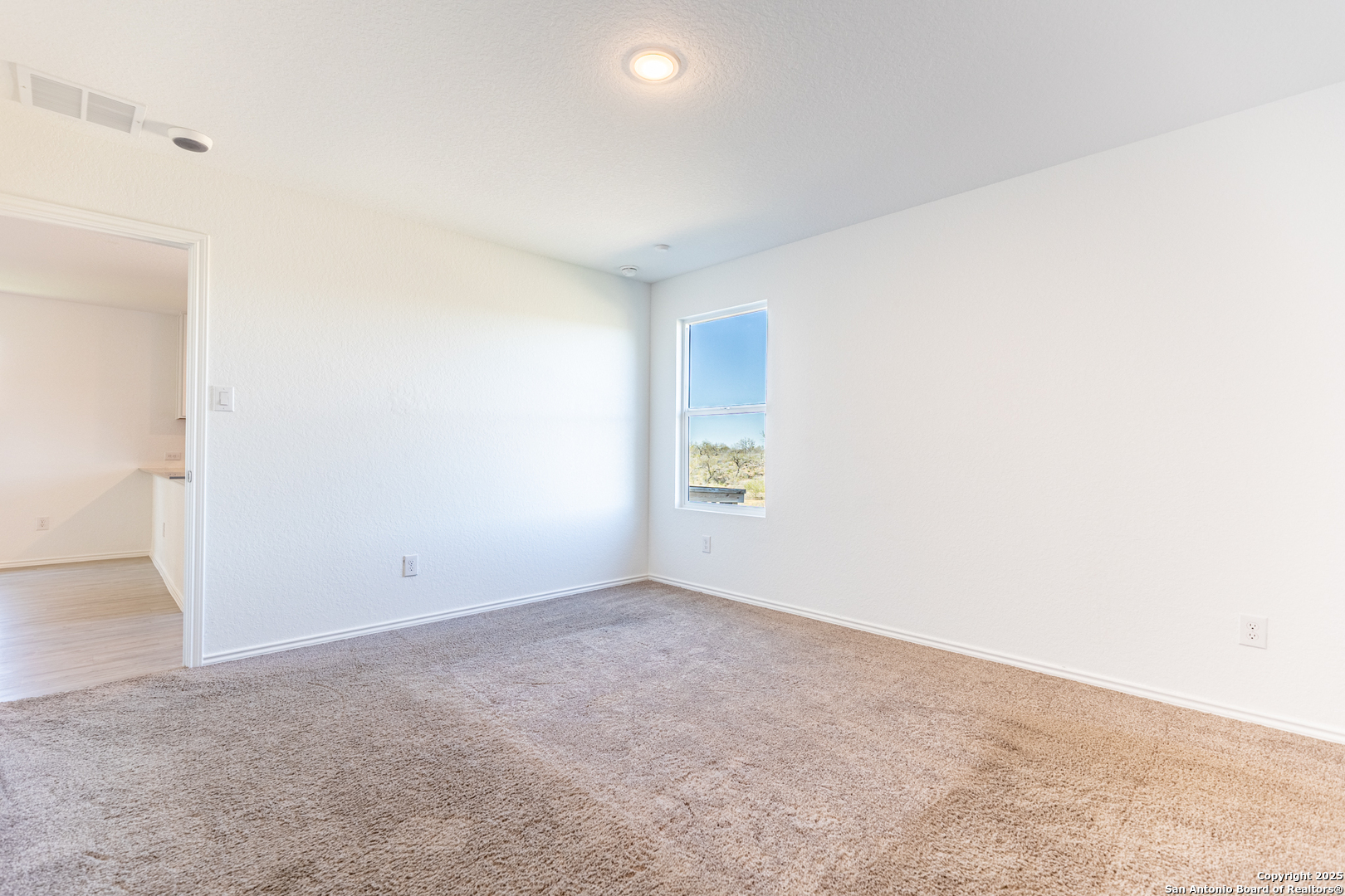 9143 Coronal Rings San Antonio, TX 78252 - Photo 19 of 30 an empty room with a window