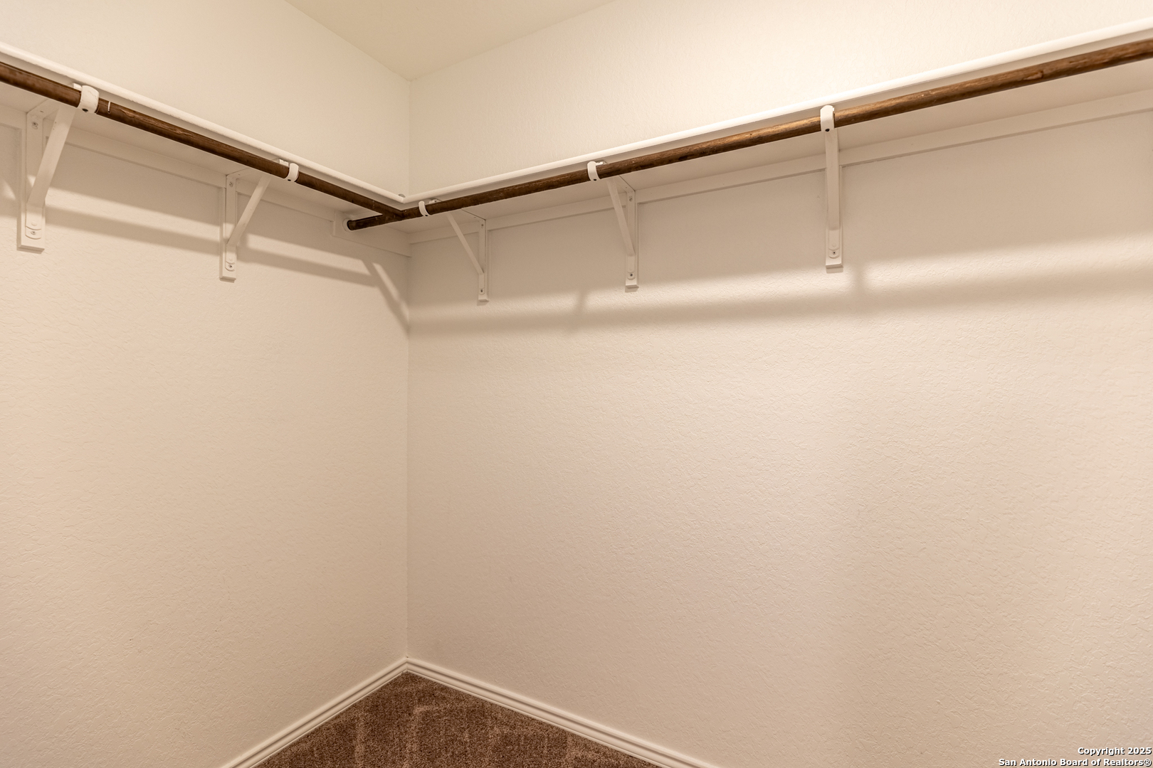 9143 Coronal Rings San Antonio, TX 78252 - Photo 22 of 30 a close up view of racks on the wall