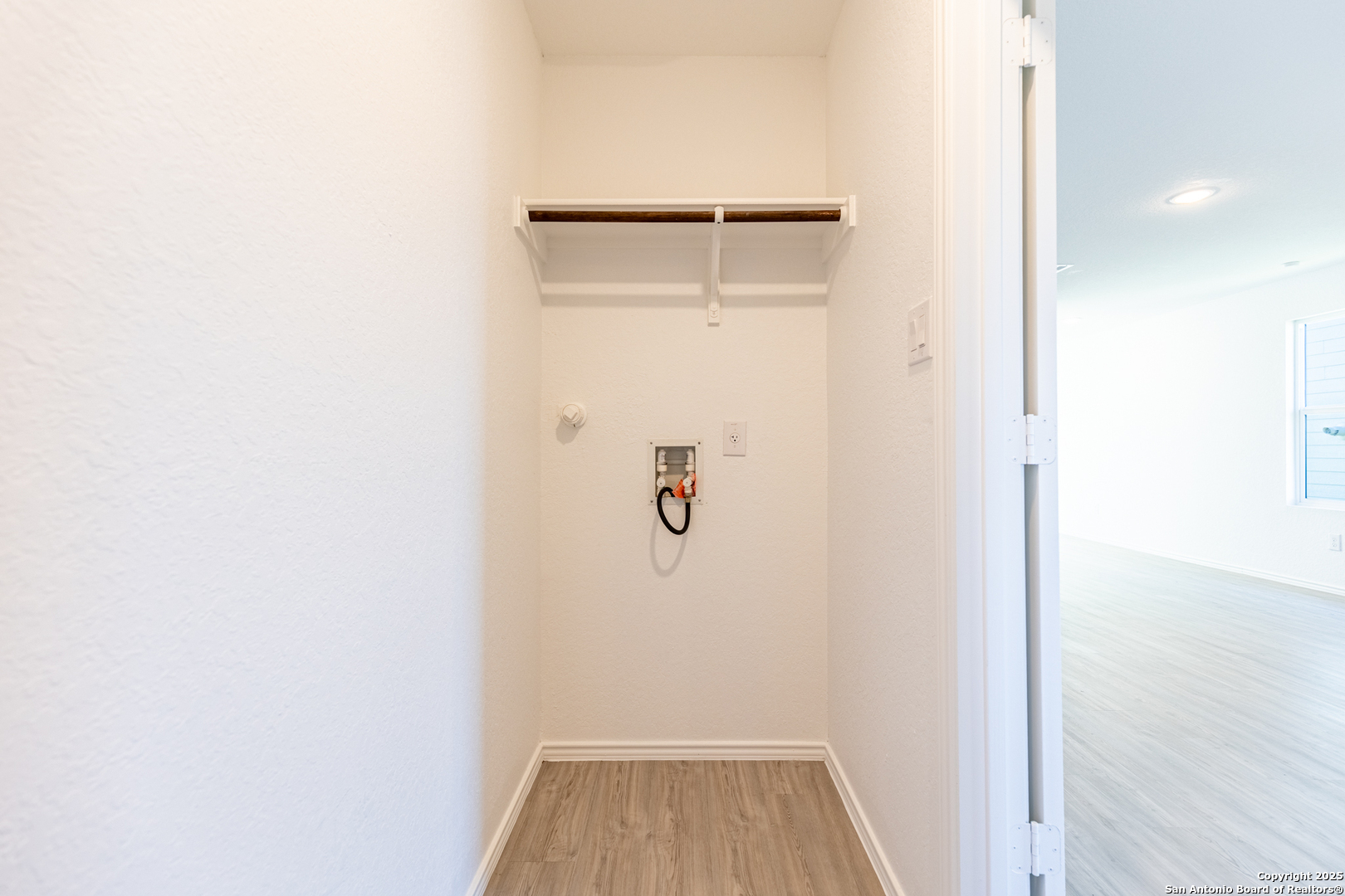 9143 Coronal Rings San Antonio, TX 78252 - Photo 23 of 30 a view of walk in closet with clothes