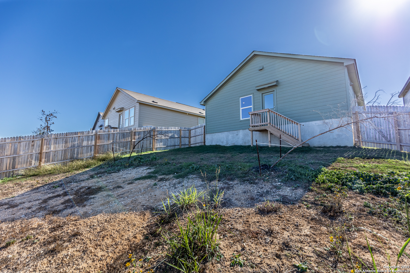 9143 Coronal Rings San Antonio, TX 78252 - Photo 28 of 30 a front view of a house with a yard and garage