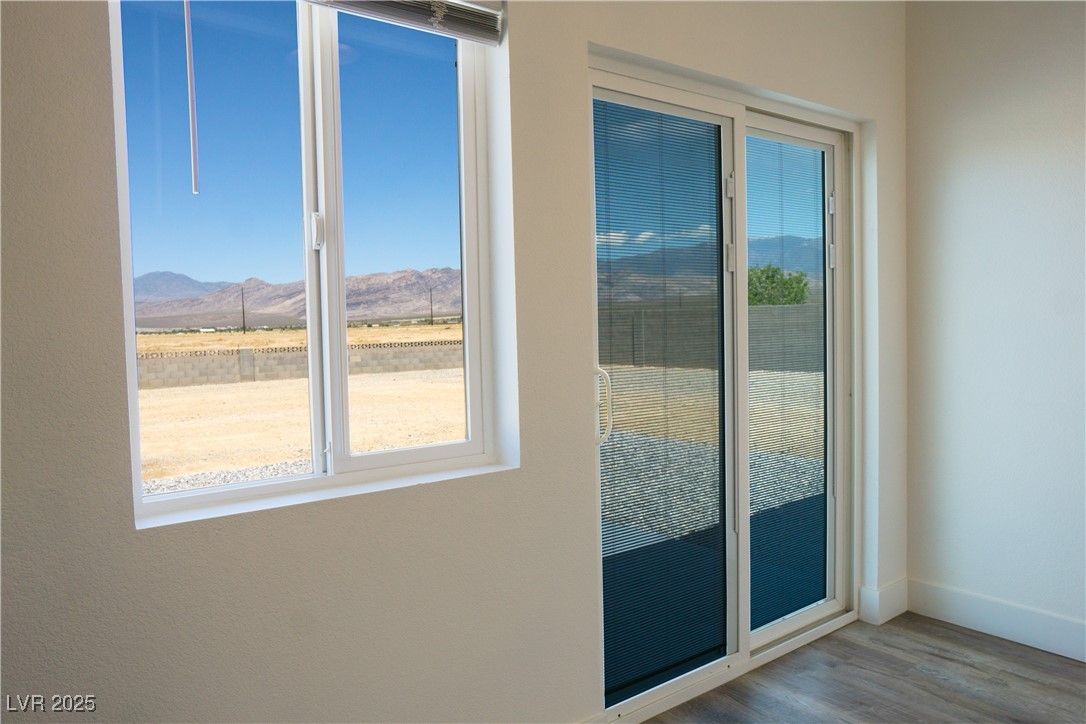 5400 Grain Mill Road Pahrump, NV 89061 - Photo 20 of 67 Entryway with a mountain view, wood finished floors, and baseboards