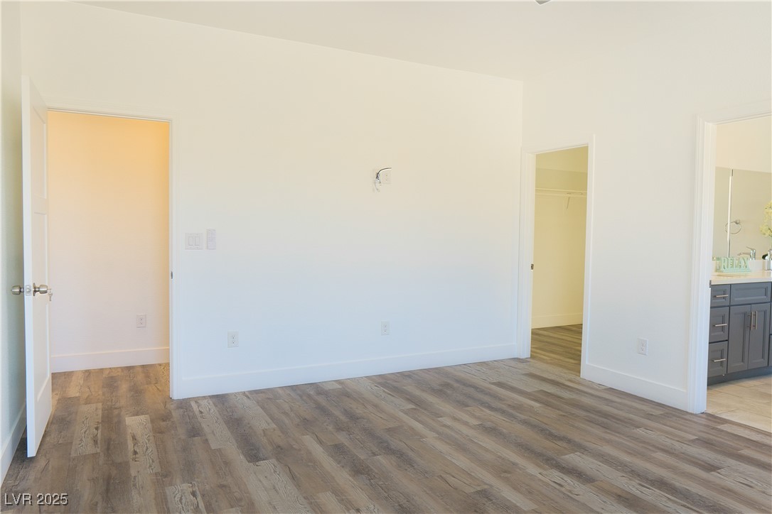 5400 Grain Mill Road Pahrump, NV 89061 - Photo 28 of 67 Unfurnished room featuring wood finished floors and baseboards